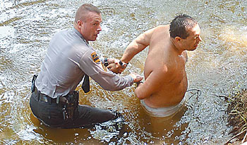 Police chase end in Tar River