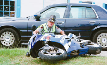 Deputy examines motorcycle after chase