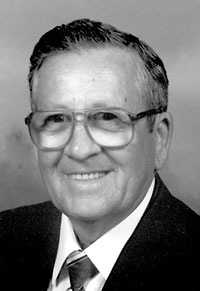 JAMES E. COKER