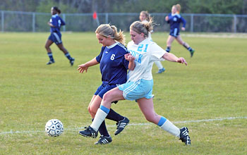 Eastern Wayne's Kasie Edwards and C.B. Aycock's Chelsey Jackson